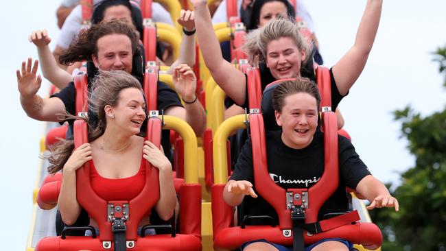 Gemma King 15 and Lochie Holman 14 (in front carriage) with Jack Cassidy 20 and Rebecca King 20 (in second behind them) enjoy the Superman Escape rollercoaster at Movie World on the Gold Coast prior to the shutdown. Pics Adam Head