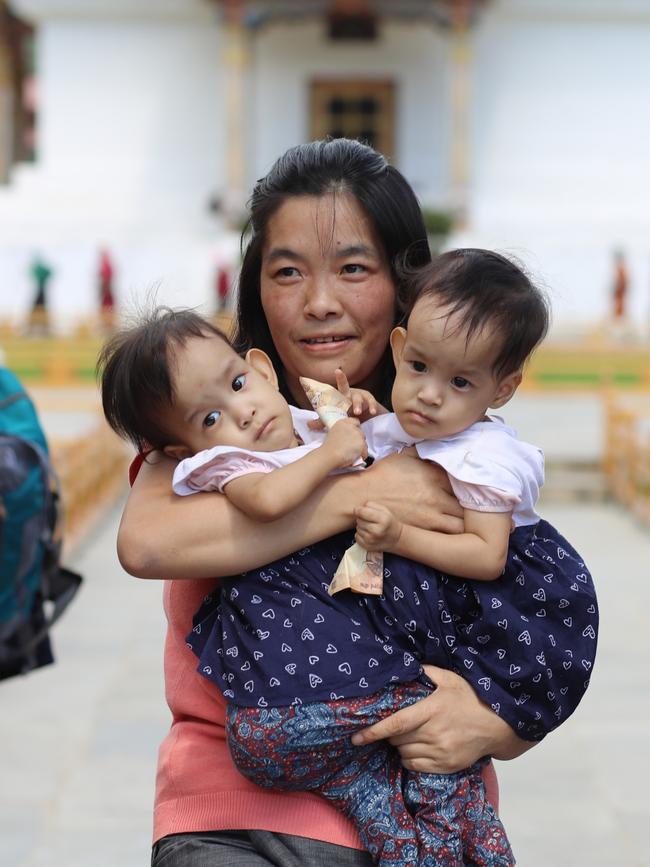 Nima and Dawa with their mum. Picture: Alex Coppel