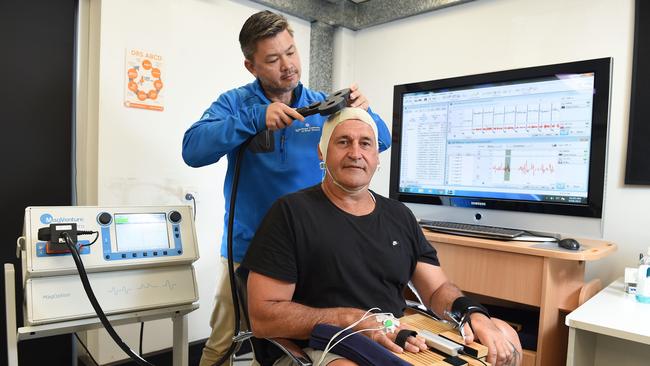 Former AFL player Rod Owen (sitting) has taken part in Dr Alan Pearce’s research on the long-term impacts of concussion. Picture: Josie Hayden