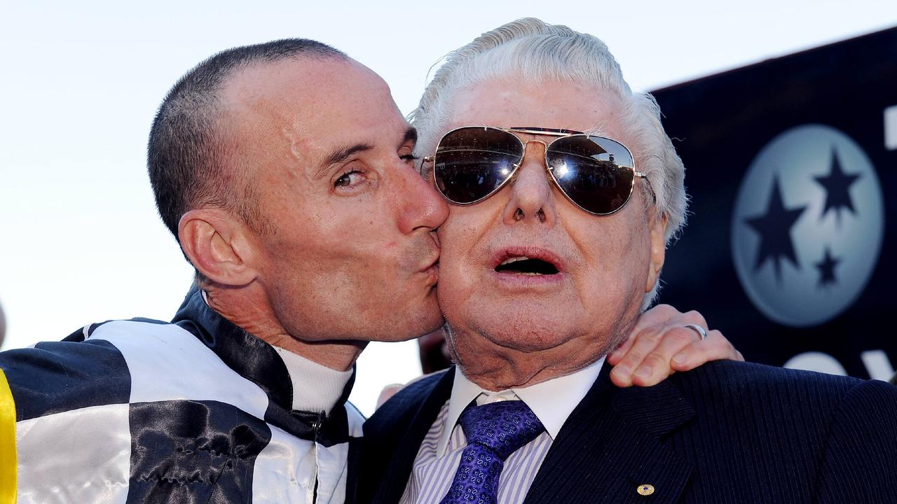 Horseracing - 2009 Tatts Cox Plate race at Moonee Valley - Race 8 Cox Plate - Jockey Glen Boss gives horse trainer Bart Cummings a kiss after his win aboard racehorse So You Think.