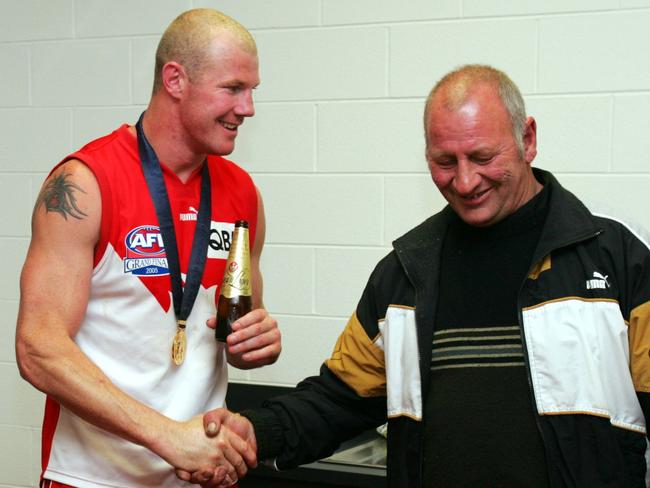 Barry Hall and his dad Ray after the game. The Swans skipper had no idea he had come to watch