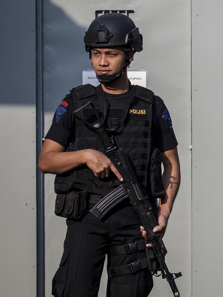 An Indonesian policeman stands guard at Wijayapura port, the entrance gate to Nusakambangan prison. Picture: Ulet Ifansasti/Getty Images