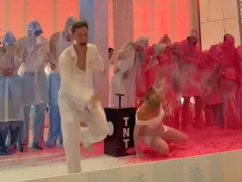 The expectant mother appeared to fall pretty hard in the pink liquid. Picture: genderrevealmiami/Instagram