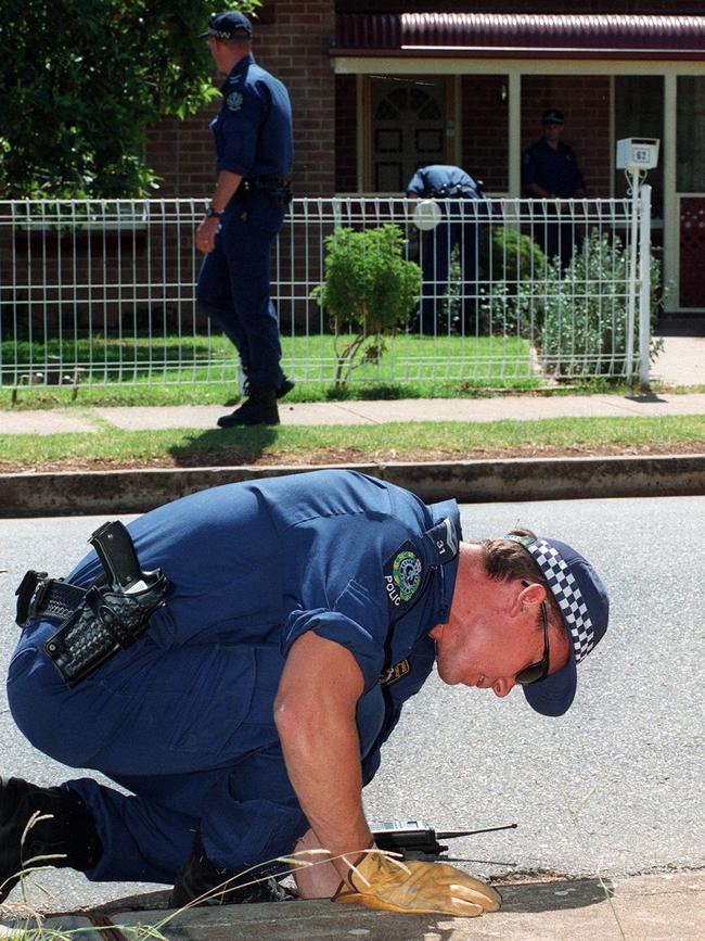 A STAR Division police officer searching for a weapon related to the murder of Phyllis Harrison.