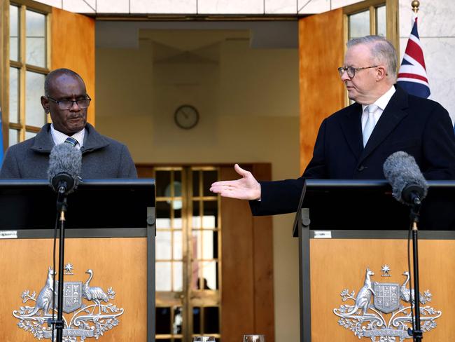 Prime Minister of the Solomon Islands Jeremiah Manele (L) and Australia's Prime Minister Anthony Albanese hold a joint press conference at Parliament House in Canberra on June 26, 2024. The new leader of Solomon Islands has announced he will visit China to "reaffirm" his commitment to working with Beijing -- a relationship viewed with unease in Western capitals. (Photo by DAVID GRAY / AFP)