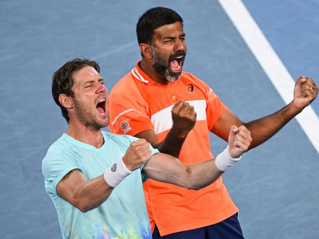 India's Rohan Bopanna (R) and Australia's Matthew Ebden celebrate after victory against Italy's Simone Bolelli and Andrea Vavassori during their men's doubles final match on day 14 of the Australian Open tennis tournament in Melbourne on January 27, 2024. (Photo by WILLIAM WEST / AFP) / -- IMAGE RESTRICTED TO EDITORIAL USE - STRICTLY NO COMMERCIAL USE --