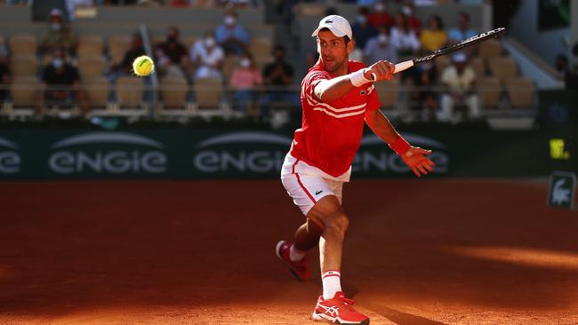 Novak Djokovic stretches to play a backhand against Stefanos Tsitsipas Picture: Getty Images