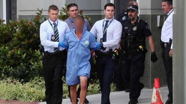 Police escorting the accused murderer Paul John Conoley, 41, from Logan Central Police Station to the Beenleigh Watchhouse. Picture: Tara Croser.