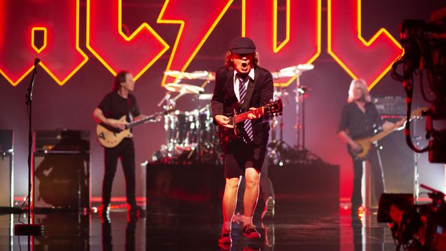 AC/DC guitarist Angus Young, centre, while recording the Shot in the Dark music video.