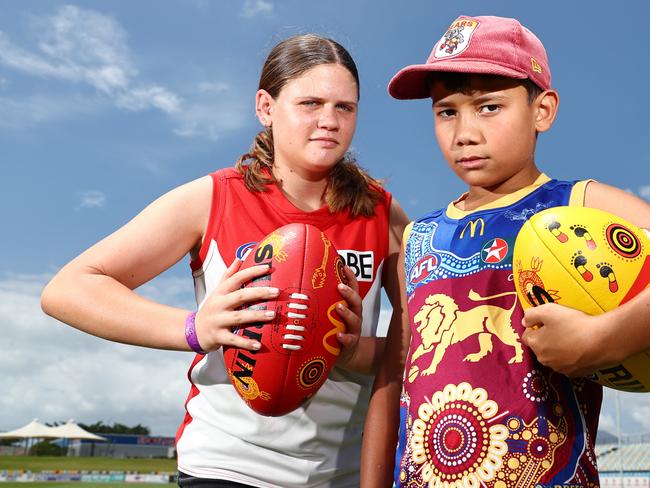 AFL Fans are readying themselves for the biggest weekend of the year, when the Brisbane Lions take on the Sydney Swans in the AFL grand final match at the MCG on Saturday. Poppy Rowden, 12, will be cheering on the Swans, while James Hanlon, 9, will be cheering on his brother-in-law Callum Ah Chee and the Brisbane Lions. Picture: Brendan Radke