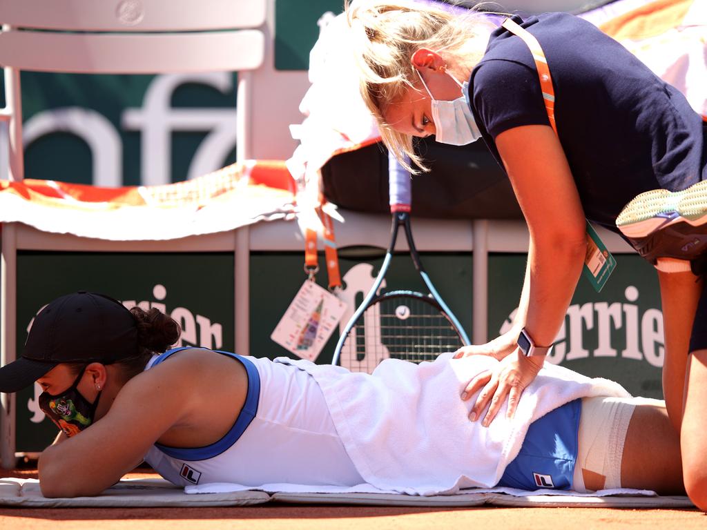 Ash Barty is given medical treatment in her first round match against Bernarda Pera at the 2021 French Open. Picture: Adam Pretty/Getty Images