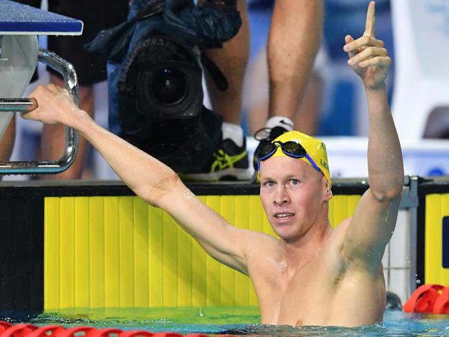 Clyde Lewis of Australia celebrates after winning the Men's 400m Inidividual Medley on day two of swimming competition at the XXI Commonwealth Games at Gold Coast Aquatic Centre on the Gold Coast, Australia, Friday, April 6, 2018. (AAP Image/Darren England) NO ARCHVIING, EDITORIAL USE ONLY