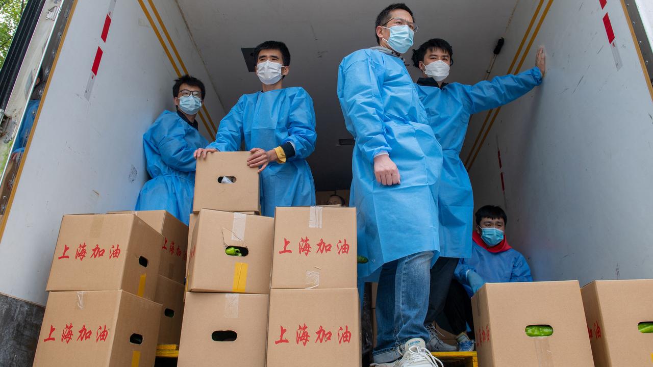 Community volunteers prepare to deliver boxes of food during the Shanghai lockdown. Picture: Liu Jin/AFP