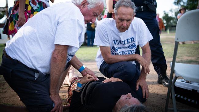 Former Greens leader Bob Brown (right) with a northern NSW woman who was injured during a Stop Adani Convoy event in Clermont. Picture: AAP/Matthew Newton