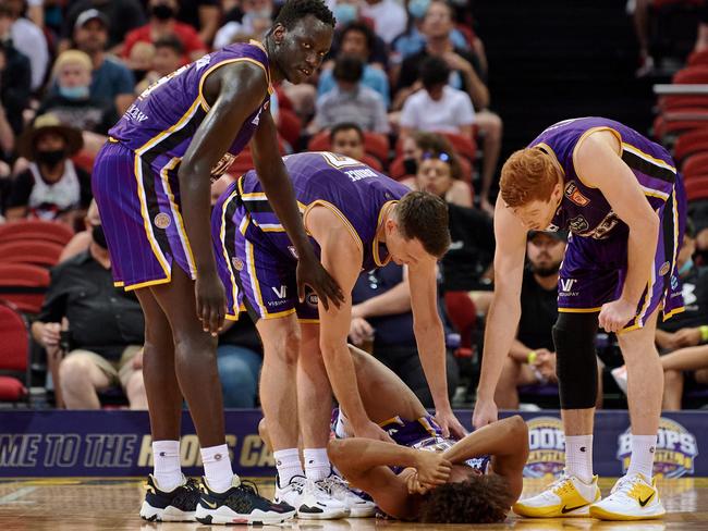 Biwali Bayles of the Kings lays on the court injured during the round four NBL match between Sydney Kings and Melbourne United at Qudos Bank Arena on Boxing Day. Photo: Brett Hemmings/Getty Images.