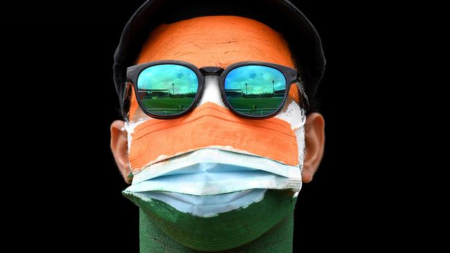 A masked India fan at the Test match in Sydney on Thursday. Picture: AFP