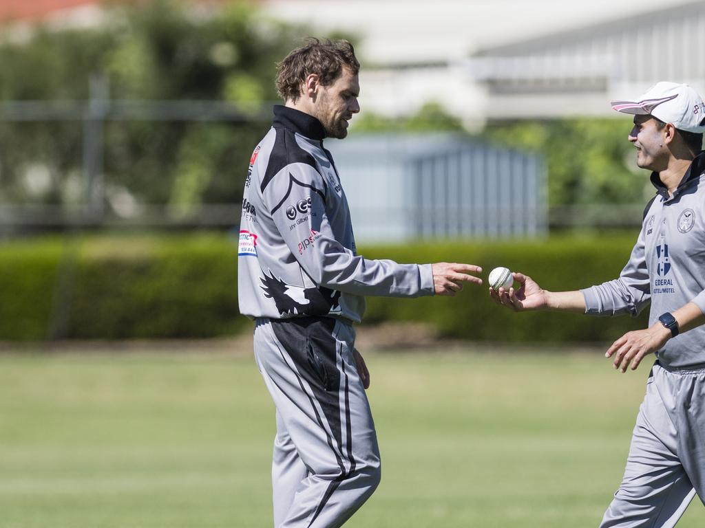 Kim Rose (left) prepares to bowl for Souths Magpies against Metropolitan-Easts in Toowoomba Cricket Reserve Grade One Day grand final at Captain Cook Reserve, Sunday, December 10, 2023. Picture: Kevin Farmer