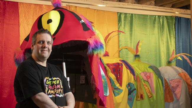 Tas Pride treasurer Vincent Bound with the World Pride Rainbow Caterpillar at Long Gallery, Hobart. Picture: Chris Kidd