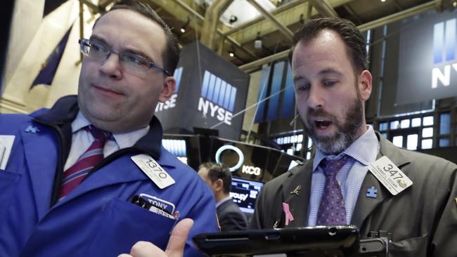 Specialist Anthony Matesic, left, and trader Thomas Cicciari work on the floor of the New York Stock Exchange, Friday, Feb. 12, 2016. U.S. stocks opened higher, seeking their first gain this week, as beaten-down energy and financial companies rebounded. (AP Photo/Richard Drew)