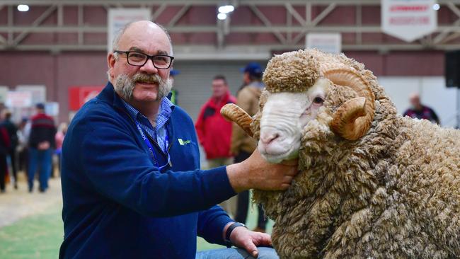 Craig Tricky from Willowvale with the Coryule superfine champion ram, which sold for $5000 at the Australian Sheep and Wool Show ram sale at Bendigo. Picture: Zoe Phillips