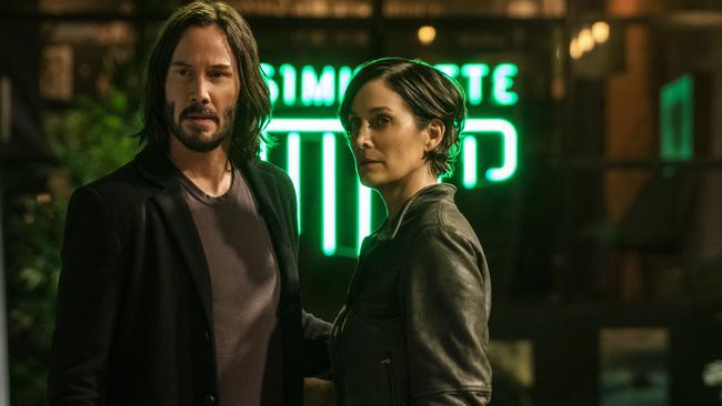 Carrie-Anne Moss and Keanu Reeves in a scene from The Matrix Resurrections.