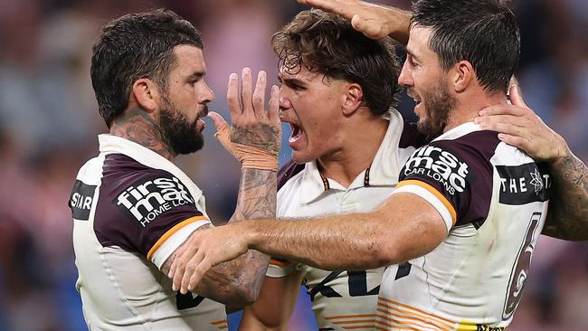 SYDNEY, AUSTRALIA - MARCH 06: AdamÃÂ Reynolds, Ben Hunt and Reece Walsh of the Broncos celebrate winning the round one NRL match between Sydney Roosters and Brisbane Broncos at Allianz Stadium on March 06, 2025, in Sydney, Australia. (Photo by Cameron Spencer/Getty Images)