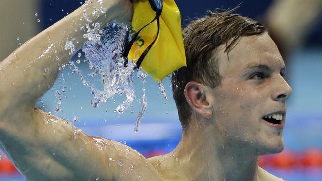 Kyle Chalmers celebrates after winning gold in the 100m freestyle.