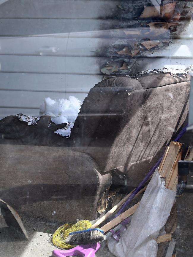 A chair inside the home where a woman allegedly set fire to her husband.