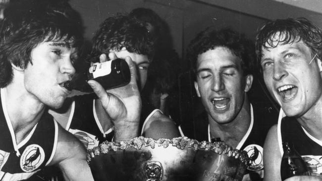 Greg Phillips, Bruce Abernethy, Chris Natt and Tony Giles celebrate winning the 1981 SANFL premiership. 