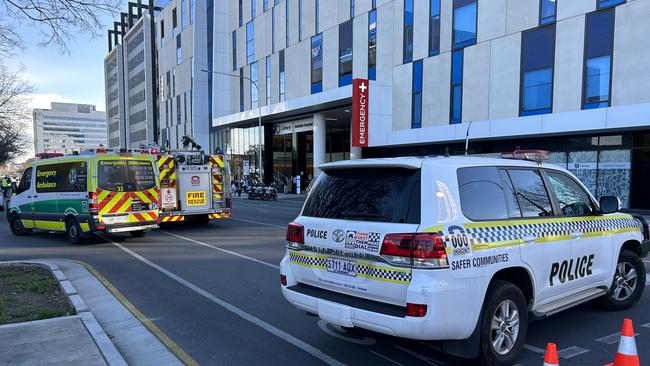 Emergency services are at the scene of a crash involving a car and a pedestrian on Angas St. Picture: Riley Walter