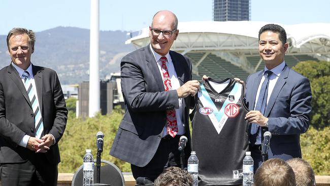 David Koch – with MG Motor Australia chief executive Peter Ciao (right) – and Keith Thomas (left) said the deal was “right up there” in terms of sponsorship arrangements for the club. Picture: Sarah Reed