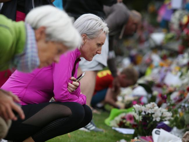  Hundreds of floral tributes run the length of a wall at the Botanic Gardens in Christchurch which has shot up as a shrine to the people killed. Picture Gary Ramage