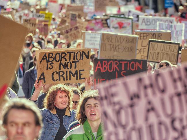 MELBOURNE, AUSTRALIA - NewsWire Photos JULY 2, 2022 People marching through the streets of Melbourne  rally is being held in Melbourne in solidarity with abortion rights protesters fighting to reinstate Roe v Wade, Picture: NCA NewsWire / Luis Enrique Ascu