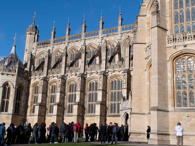 Tourists visit St George's Chapel in the afternoon sunshine, inside the grounds of Windsor Castle in Windsor, west of London. Picture: AFP