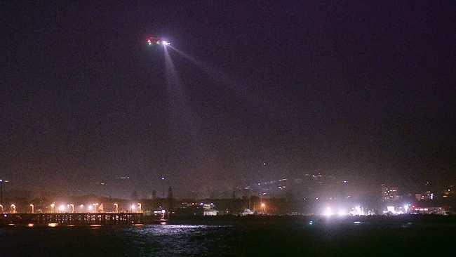 Authorities search for a man washed off the southern breakwall at Coffs Harbour on Thursday January 21.  Photo by Frank Redward