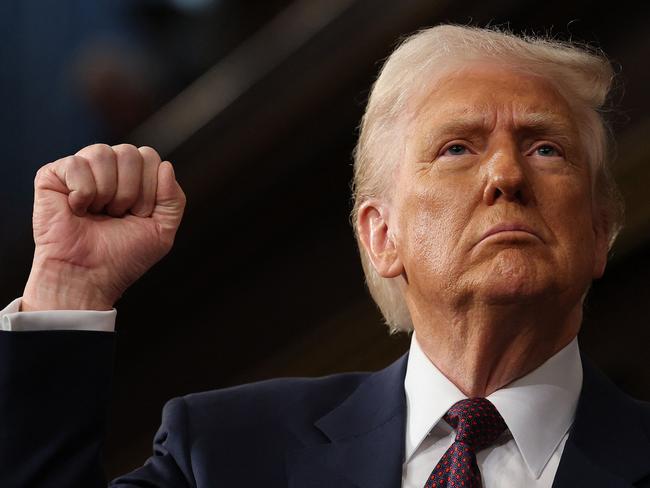 US President Donald Trump raises his fist as he addresses a joint session of Congress at the US Capitol in Washington, DC, on March 4, 2025. (Photo by Win McNamee / POOL / AFP)