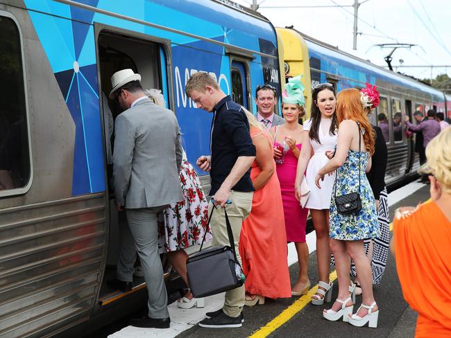 Racegoers board trains to return to the city after Melbourne Cup Day 2014 at Flemington Racecourse. Picture: Nathan Dyer