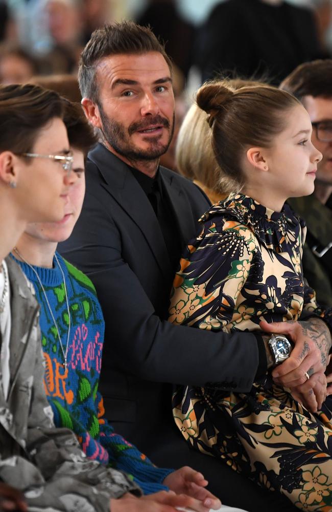 Romeo, Cruz, David and Harper Beckham at London Fashion Week. Picture: AFP