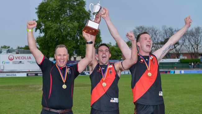 TTG coach Justin Maschotta, co-captains Chad Schoenmakers and Blake Penney hold up the trophy in 2018. Picture: Brenton Edwards