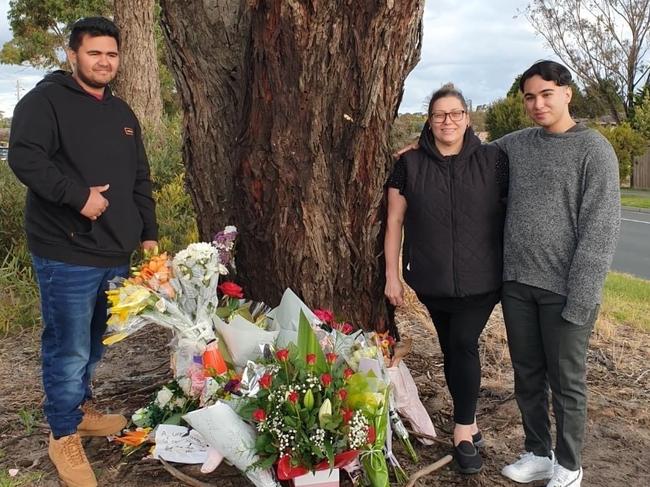 Loved ones visit the site of Carrum Downs hit-run victim Timmy Rakei on Thursday. Tania Boyte, his partner, is the female along with two male relatives.