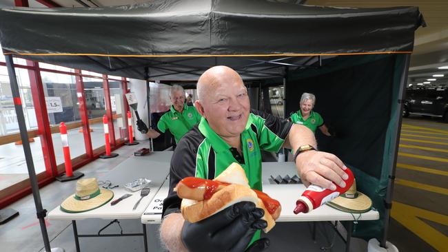 Gold Coast Tllebudgera Lions club members Cliff Hitch (left), Roy Mitchell (middle) and Christine de Brito (right) at Bunnings Burleigh Waters getting ready to celebrate the return of the Bunnings sausage sizzles. Picture: Glenn Hampson