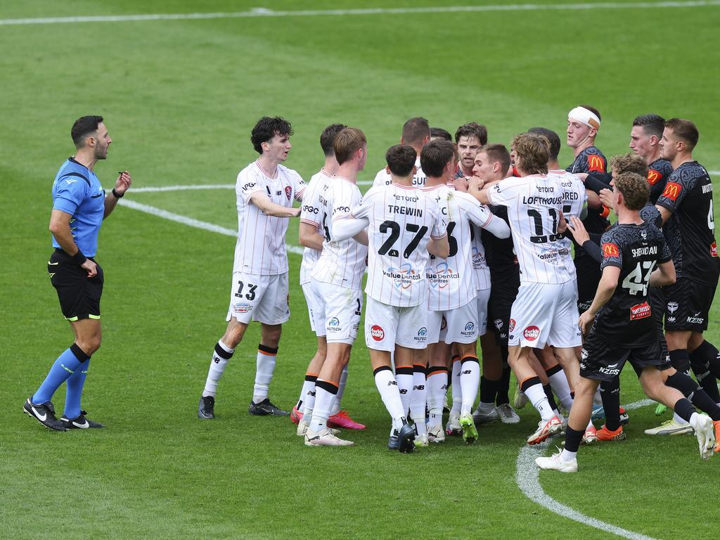 Roar and Phoenix players clash after Alex Rufer’s foul on Henry Hore. Picture: Hagen Hopkins/Getty Images