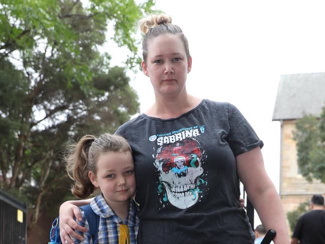 Natasha Haugh walks  Holly to school with Hugo in his pram for her return to Ryde public school today . Picture John Grainger