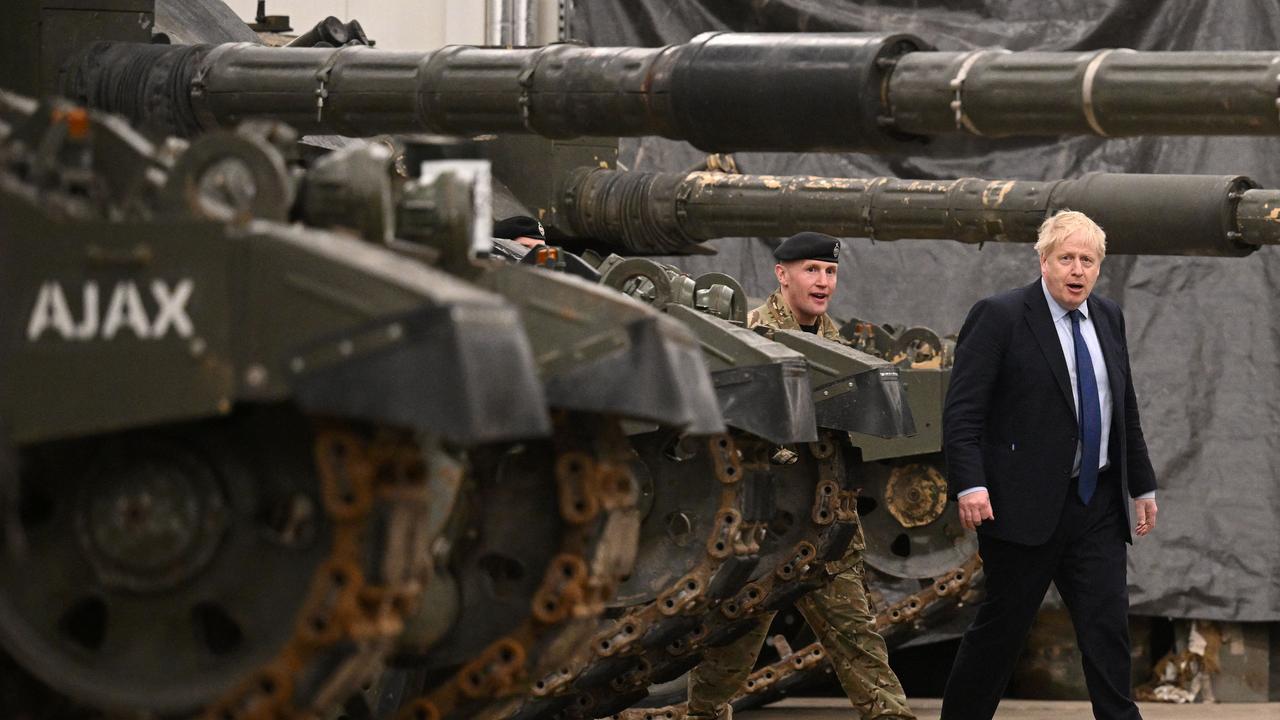 British Prime Minister Boris Johnson meets NATO troops after a joint press conference at the Tapa Army Base on March 1, 2022 in Tallinn, Estonia. - British Prime Minister Boris Johnson said on a visit to Poland on March 1, that the West would keep up sanctions pressure on Russian President Vladimir Putin's regime indefinitely after it invaded Ukraine (Photo by Leon Neal / various sources / AFP)