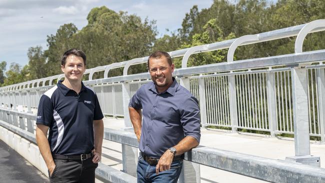 Peet Limited Queensland Project Director, Jonathon Lawson (left) and Moreton Bay Regional Council Councillor, Adam Hain (right) on the new Cundoot Bridge linking Market Drive with Graham Rd and the Bruce Highway.