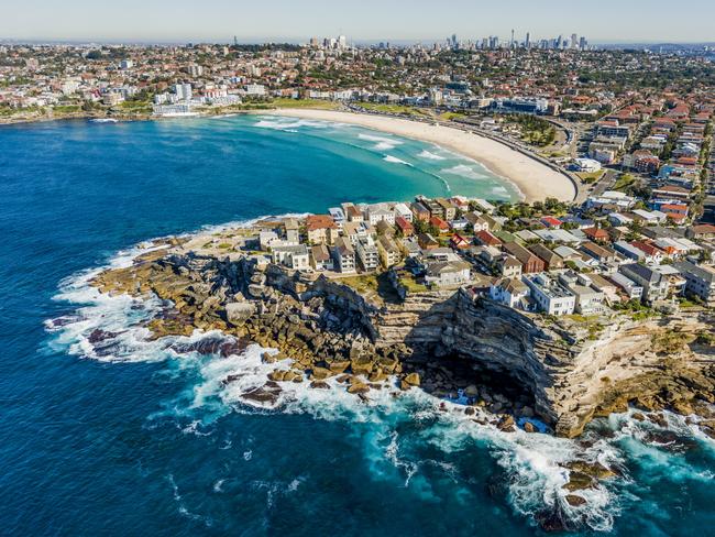 Aerial view of Bondi Beach with the Sydney CBD in the background.Escape 28 April 2024Why I Travel - Carla OatesPhoto: iStock