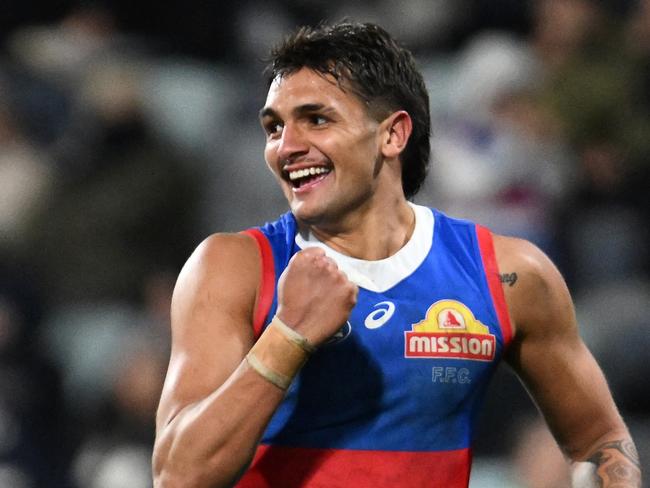 GEELONG, AUSTRALIA – JULY 20: Jamarra Ugle-Hagan of the Bulldogs celebrates kicking a goal during the round 19 AFL match between Geelong Cats and Western Bulldogs at GMHBA Stadium, on July 20, 2024, in Geelong, Australia. (Photo by Daniel Pockett/Getty Images)