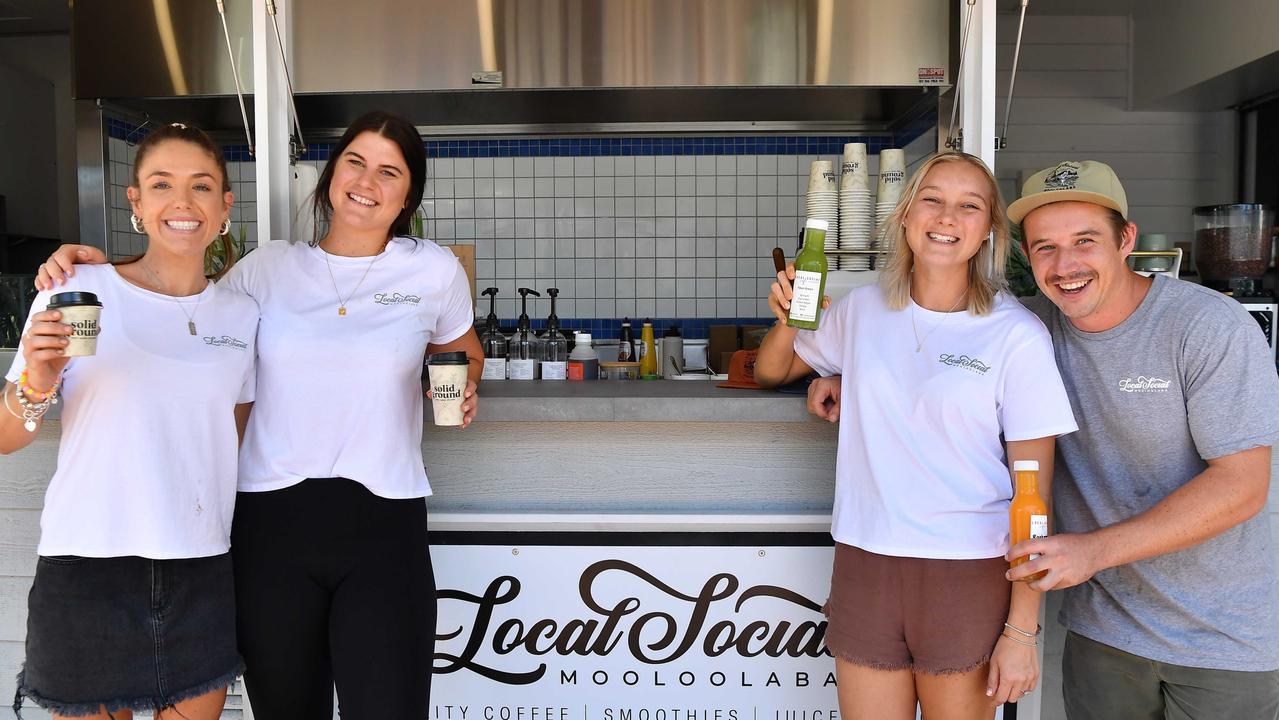 Kristy Knox and Jake Jodvalkis (right) have opened a new cafe The Local Social on the wharf Mooloolaba. Picture with staff members Josie Taylor and Jamie Keightley. Photo: Patrick Woods.