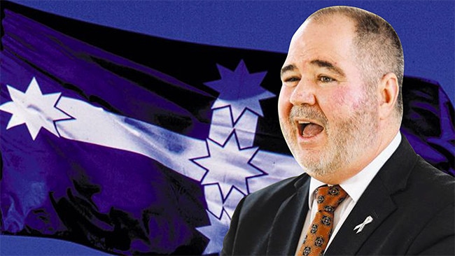 Queensland Teachers’ Union president Kevin Bates and the Eureka Stockade flag that signifies solidarity with the construction union.