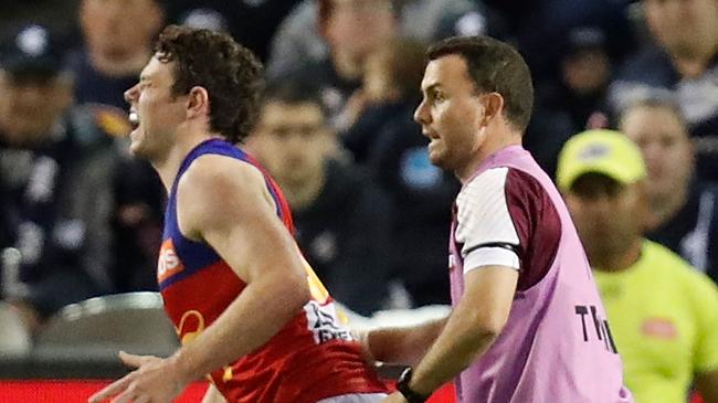 Lachie Neale in pain after suffering an ankle blow. Picture: Getty Images